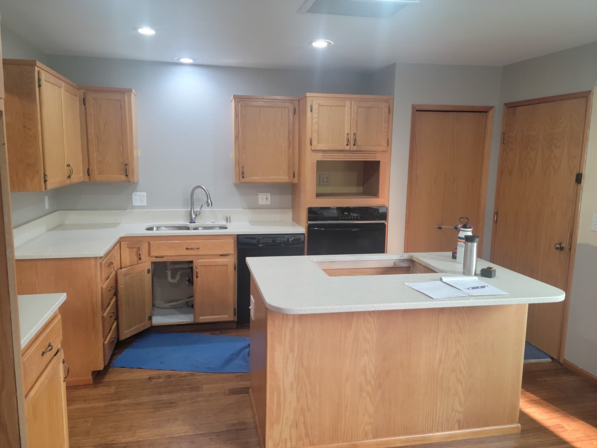 Dated oak kitchen with laminate counters before remodeling work began